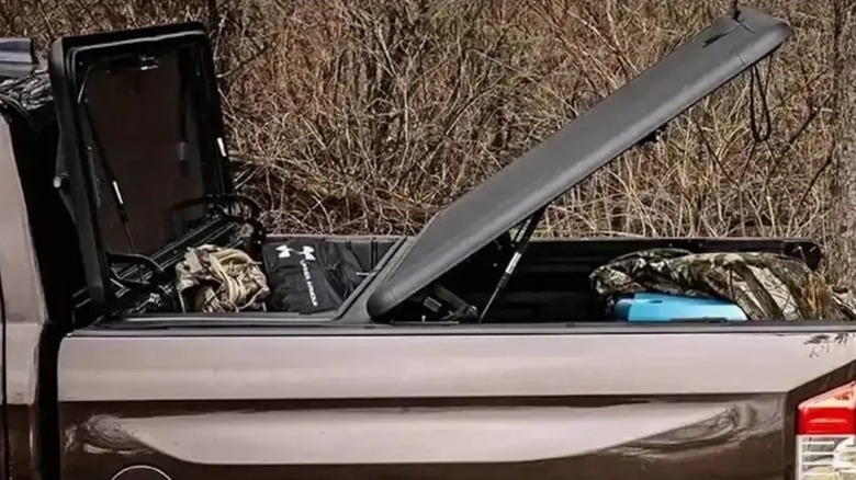 Combination tool box and tonneau cover on a gray pickup truck