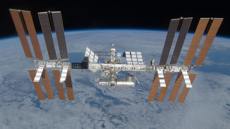 The International Space Station hangs over the Earth