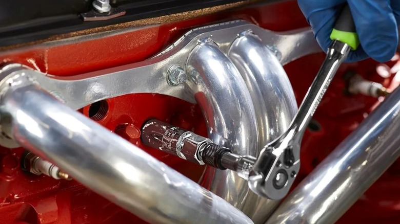 Using a Harbor Freight spark plug socket on an engine.