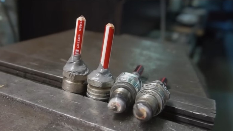Four spark plugs with infused pencil cores