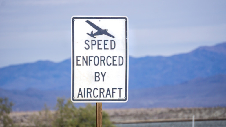 Speed Enforced by Aircraft sign in desert