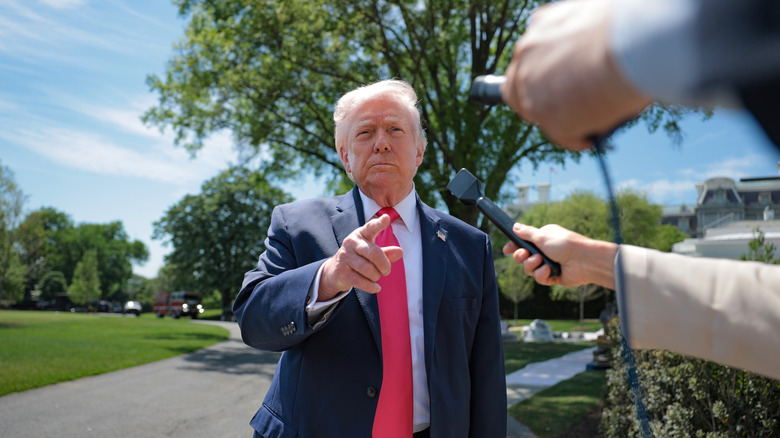 U.S. President Donald Trump speaks to the media before boarding Marine One on the South Lawn of the White House on April 16, 2026 in Washington, DC.