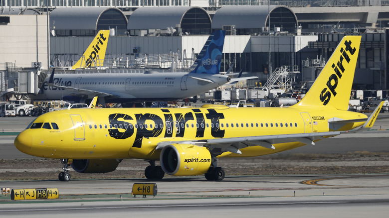 A Spirit Airlines A320 airplane taxis at Los Angeles International Airport after arriving from Detroit on October 17, 2025 in Los Angeles, California.