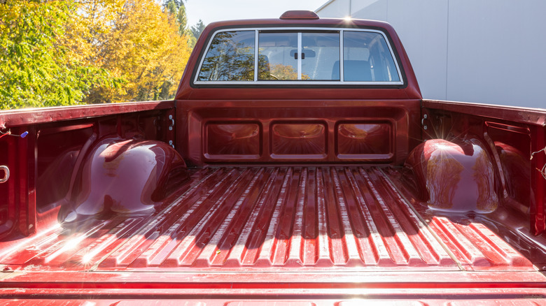 A bare metal truck bed without a liner.