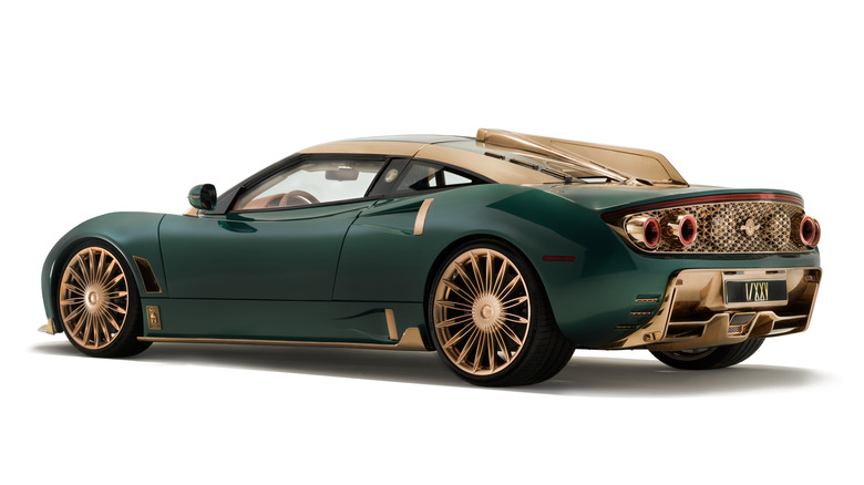 Rear 3/4 view of a green Spyker C8 Preliator XXV