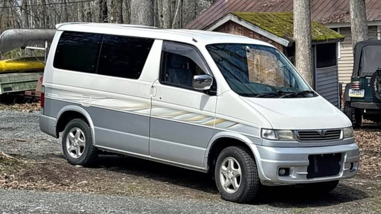A white and gray Mazda van