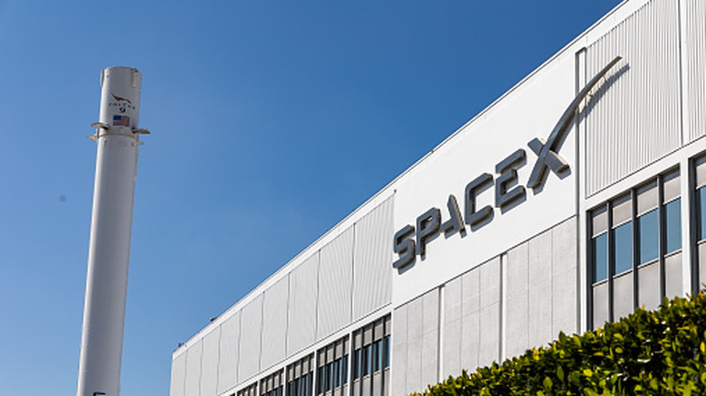 The Headquarters of SpaceX in Hawthorne, California, with a Falcon 9 booster in March 2024.