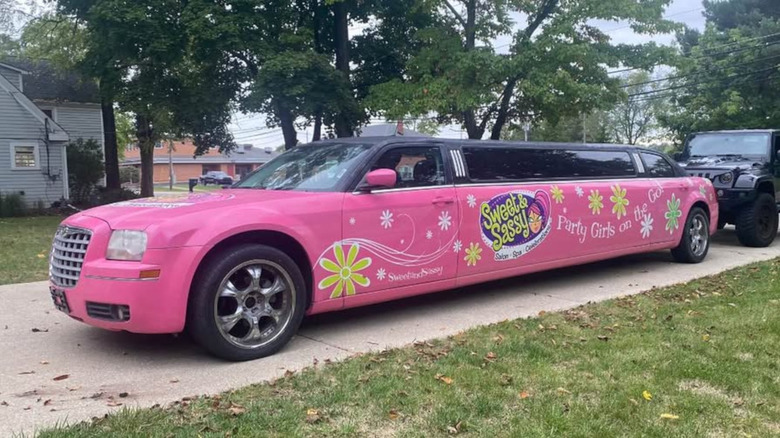 A pink Chrysler 300 stretch limo