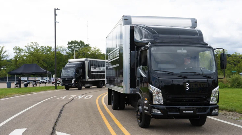 two Bollinger trucks