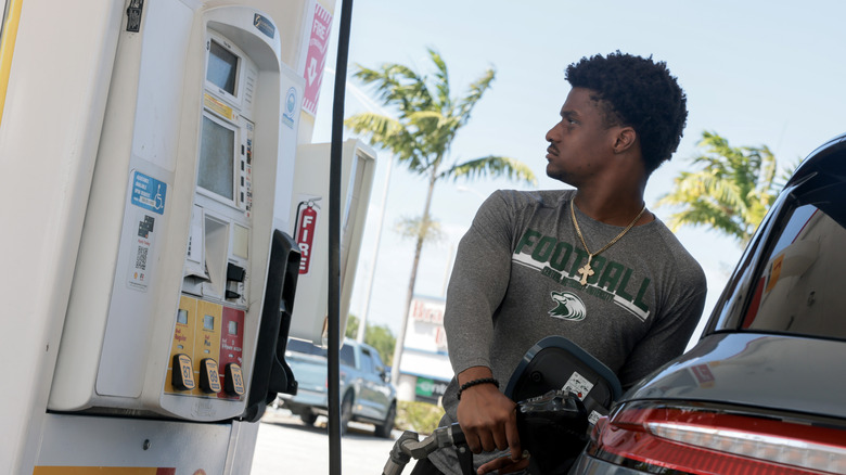 Kyndal Royal fills his vehicle with fuel at a gas station on April 13, 2026 in Miami, Florida.