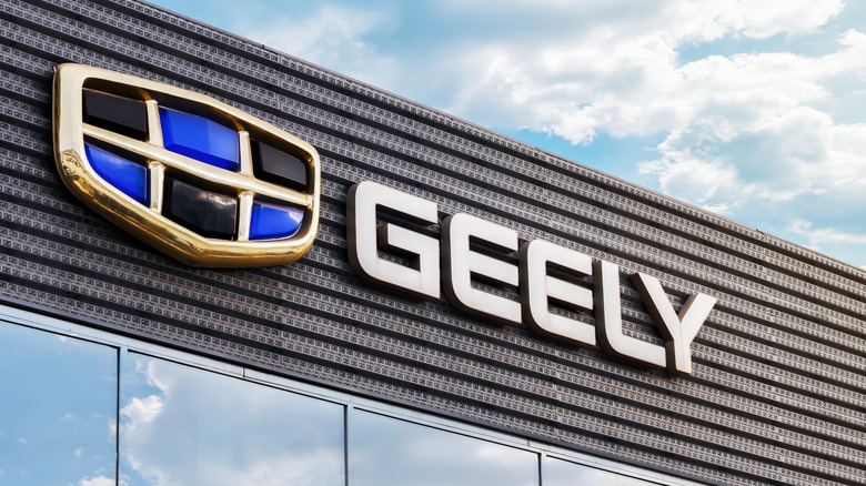 Krasnoyarsk, Russia , January 14, 2025: importance separated by commas without numbering: The logo of the automaker Geely on the facade of the dealership. Geely is a growing and powerful auto brand