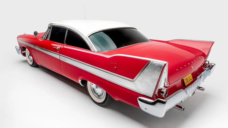 A rear three-quarter profile view of a red 1958 Plymouth Fury from the film "Christine."