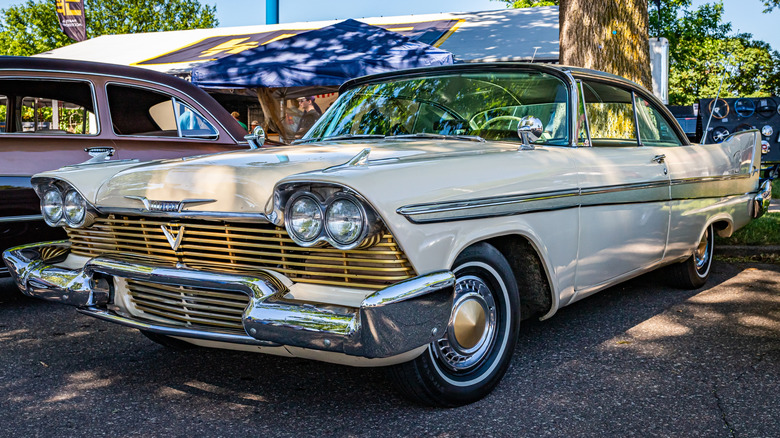 An original 1958 Plymouth Fury, painted Buckskin Beige with gold trim.