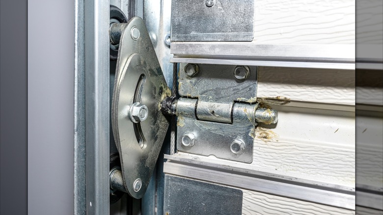 A garage door roller and track assembly.