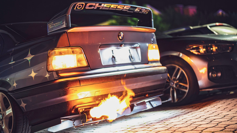 A modified BMW's exhaust spitting fire