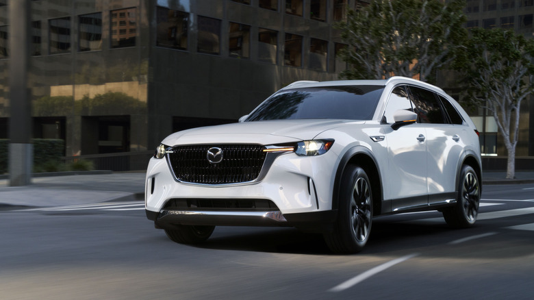 2025 Mazda CX-90 front 3/4 view while cornering