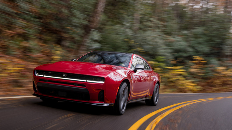 2026 Dodge Charger SIXPACK Scat Pack front 3/4 view while cornering at speed