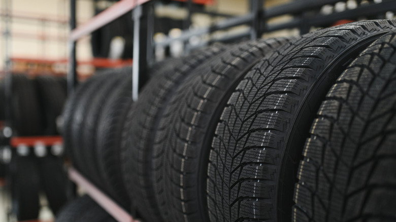 A storage rack filled with road tires
