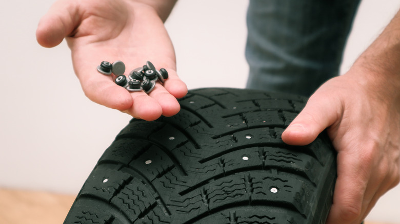A handful of tire studs used for a studded tire