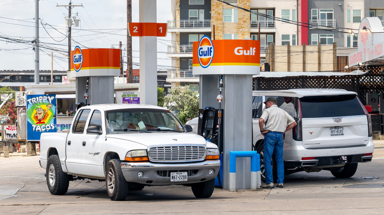 A person pumps gas at a Gulf gas station on June 25, 2026 in Austin, Texas.