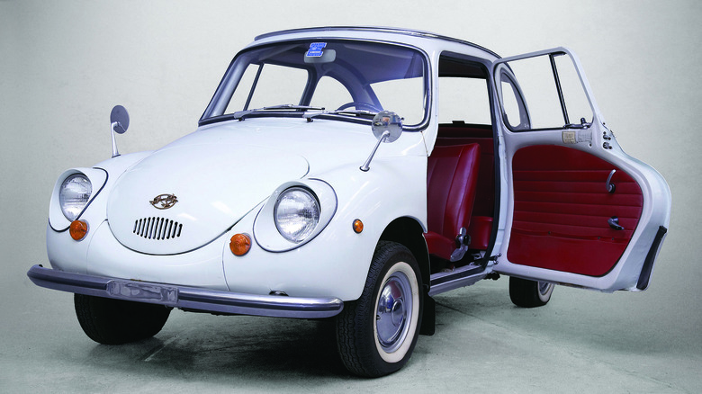 White Subaru 360 front left view with door open in studio