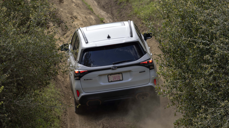 Rear overhead view of a white Subaru Forester.