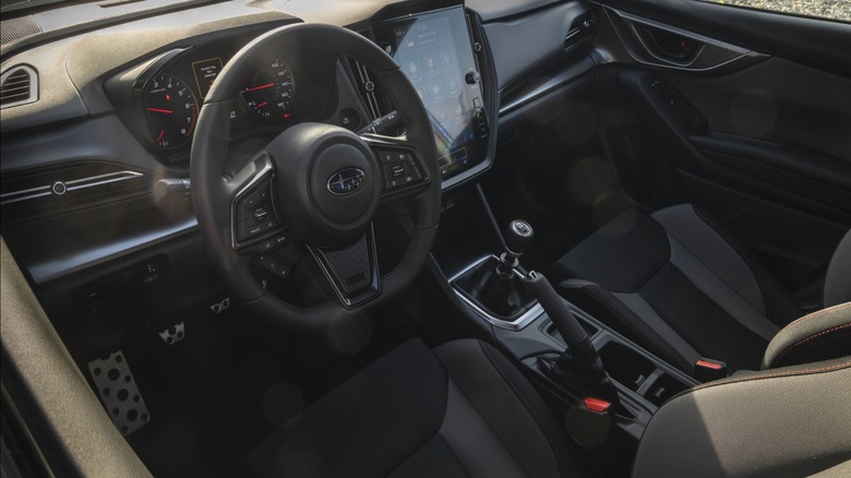 A look in the driver's door at the dashboard and driver's seat in the WRX Base