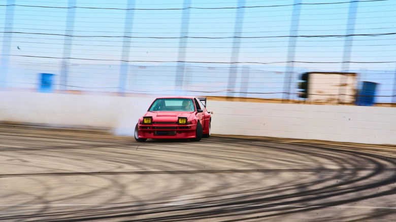 Lola, a red Toyota AE86 drifts into the turn on a race course in Sung Kang's film "Drifter."