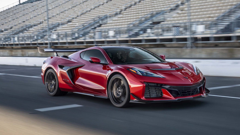 A track-side shot of the 2026 Chevrolet Corvette ZR1X in a deep metallic red finish, captured at Sonoma Raceway.