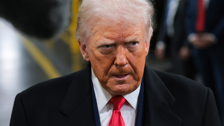 Trump looking angry at Ford plant