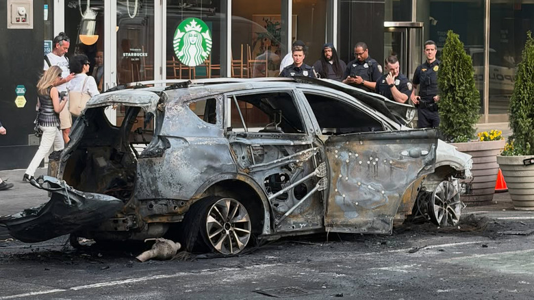 The charred remains of a Toyota RAV4 on Broadway