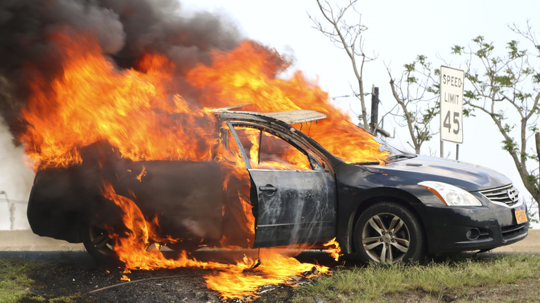 This Nissan mid size sedan burning profusely on the shoulder of the Garden State Parkway, luckily the driver and all passengers escaped injury.