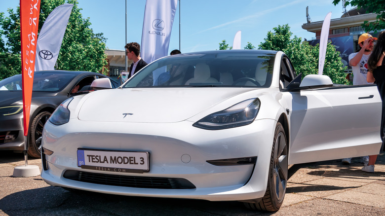 Bucharest, Romania - 05.20.2022: Close up with the Model 3 of the famous american luxury electric car brand Tesla