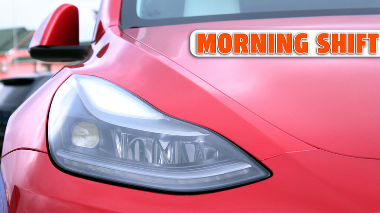 Vinnytsia, Ukraine; April 10, 2026. Close up red Tesla Y headlight. Tesla Y front of the car. Tesla Y LED lights. Modern USA car headlight. Headlight premium electric car.