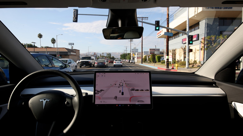 Interior of a Tesla Model Y in Full Self-Driving Mode in LA suburb traffic