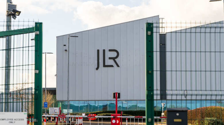 Jaguar Land Rover motor company logo and name outside of a car engine factory