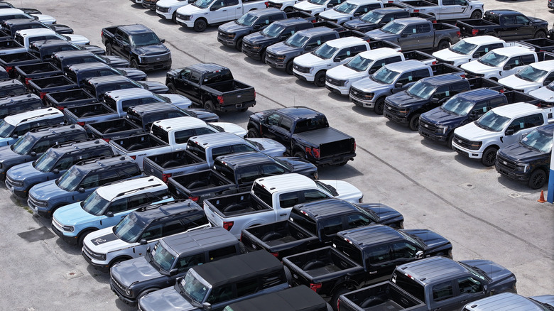 An aerial view as Ford vehicles are lined up on the sales lot of the Metro Ford dealership on May 06, 2025 in Miami, Florida. Ford Motor Co. pulled its 2025 guidance and said it expects a tariff hit of about $1.5 billion for the year as U.S. automakers face economic uncertainty.