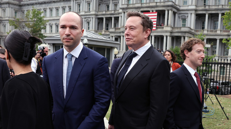WASHINGTON, DC - SEPTEMBER 29: (L-R) Greg Brockman, President and co-founder of OpenAI, Elon Musk, CEO of Tesla and SpaceX, and Mark Zuckerberg, CEO of Meta Platforms walk to a press briefing with U.S. President Donald Trump and fellow AI executives following a meeting on artificial intelligence outside the West Wing of the White House on September 29, 2026 in Washington, DC. The meeting comes as some have called for a slowdown in AI development amid rising safety concerns. (Photo by Kevin Dietsch/Getty Images)