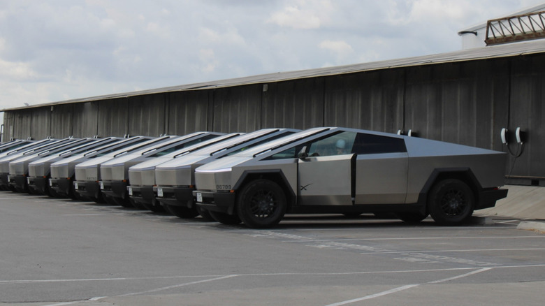 Starbase, Texas USA November 22 2025, A employee exists a Tesla Cybertruck outside the entrance of SpaceX Starbase facility