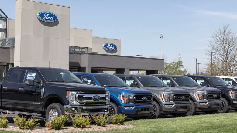 Zionsville - Circa April 2023: Ford F-250 and F-150 display at a dealership. Ford F-Series pickups are the best selling trucks in the US.
