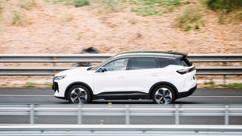 Torrelavega, Spain - 3 August, 2026: A Ebro S700 / Chery Tiggo 7 car in motion on a highway