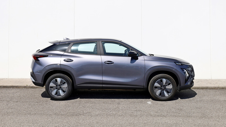 Udine, Italy. May 28, 2026. Omoda C5,  also called Chery Omoda 5, at the roadside with white wall on background.