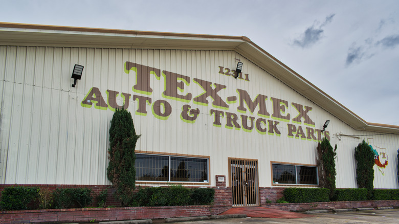 Houston, Texas USA 12-05-2021: Tex-Mex Auto and Truck Parts business exterior in Houston, TX. Local automotive salvage company front entrance.