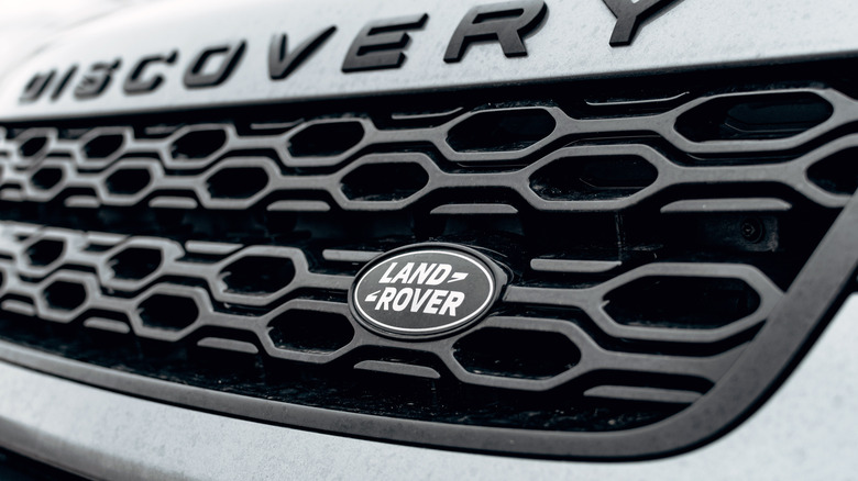 Zagreb, Croatia – December 30, 2021: A mesh grille with black trim around Land Rover logo