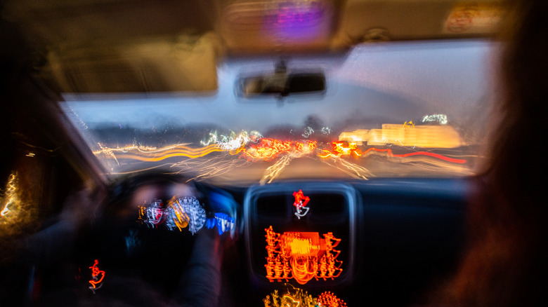 Blurred photo from inside a car at night