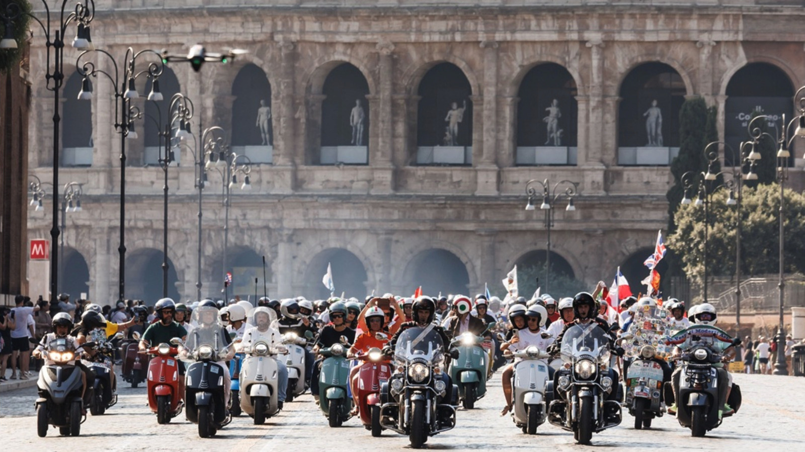 Thousands ride Vespas in Rome to celebrate scooter's 80th anniversary