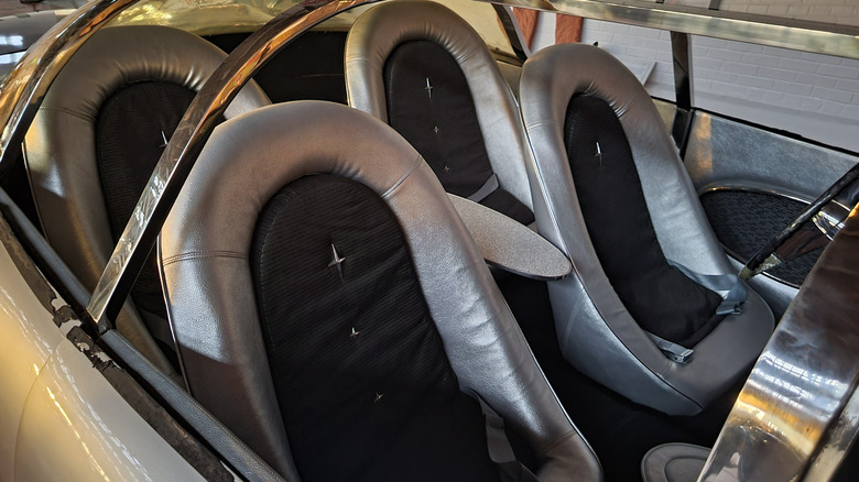 Interior of 1957 Aurora Safety Car showing padded swiveling bucket seats