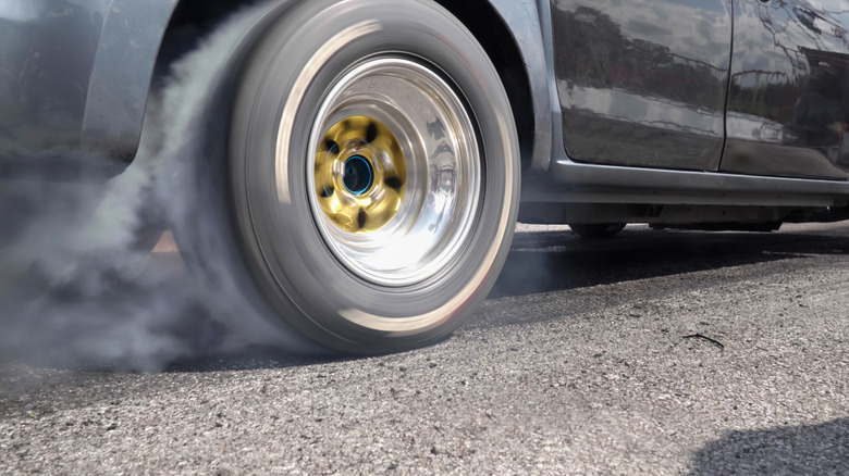 A drag racing car doing a burnout.