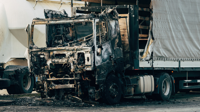 A burned semi-truck after an accident
