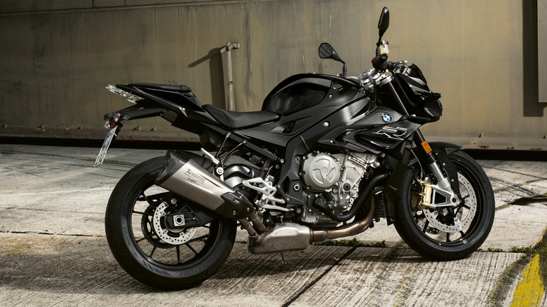 A black BMW S 1000 R motorcycle on display